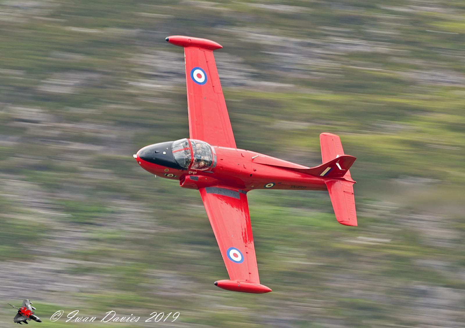 Red Jet Provost in flight over UK countryside